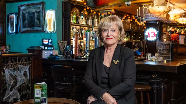 Betty Runge, owner and host of Dublin Inn Hannover, at the bar